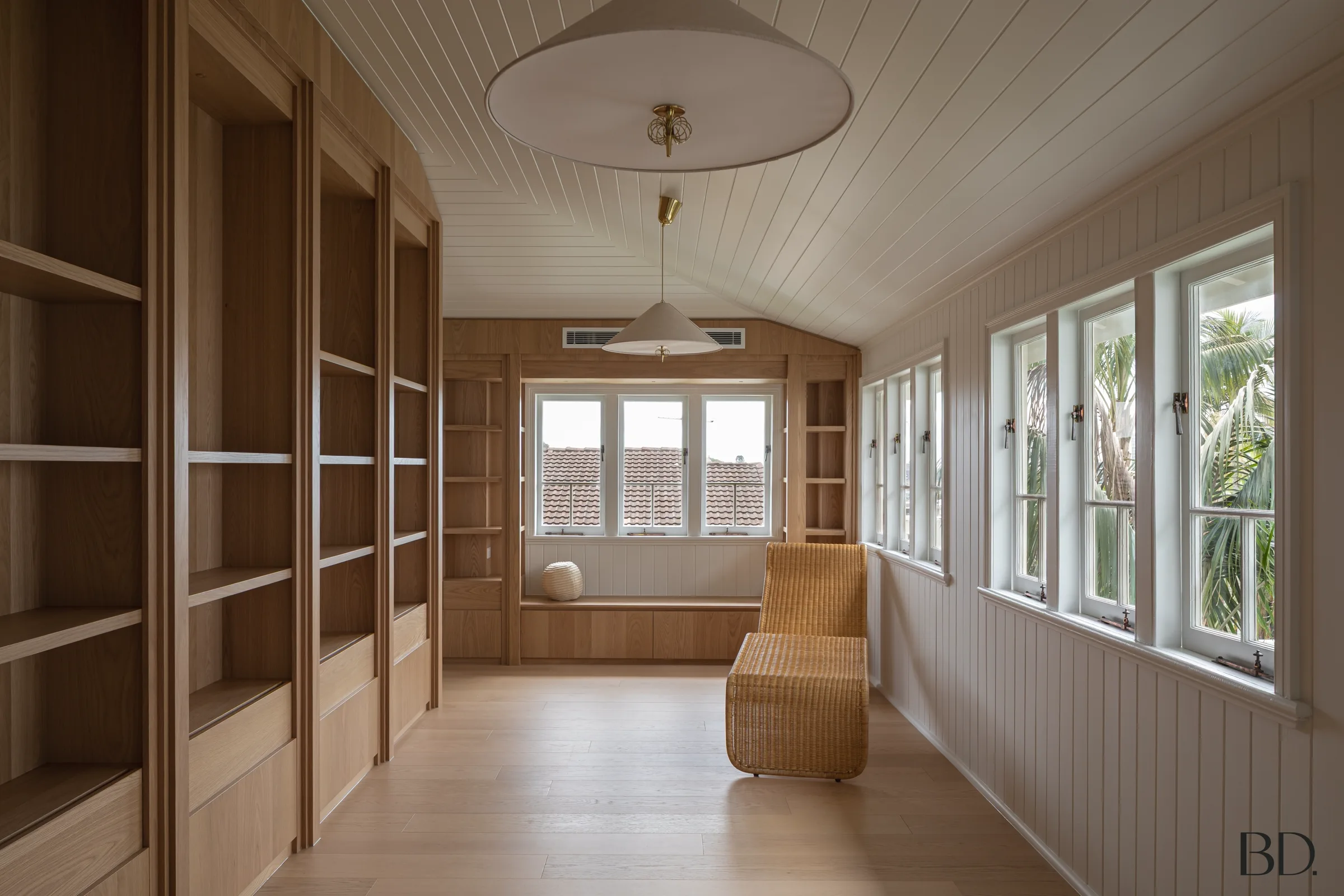 Queenslander interior with painted VJ walls, timber joinery and a pressed-metal ceiling rose.